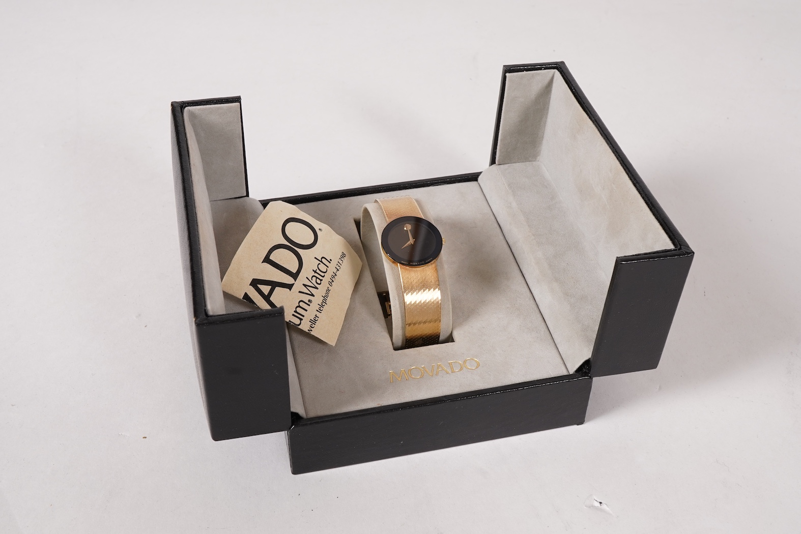 A lady's late 20th century Swiss Movado Museum 14k yellow metal quartz wrist watch, on an integral Italian 14k bracelet